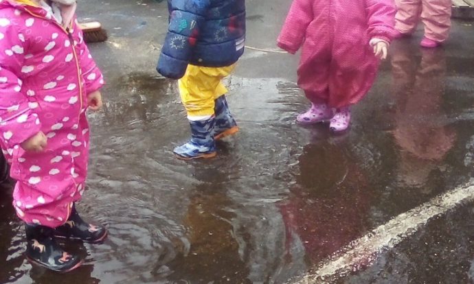 Children playing in the rain