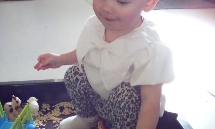 Child exploring textures