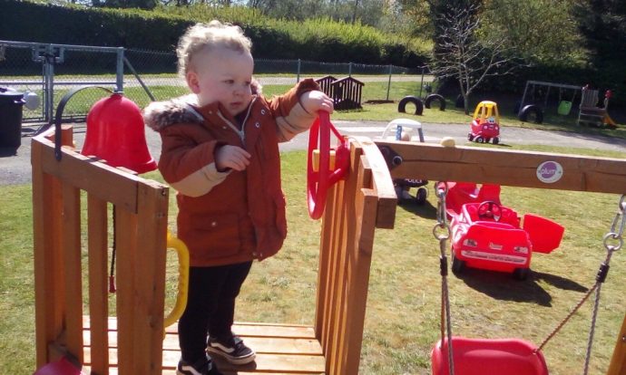child playing in garden